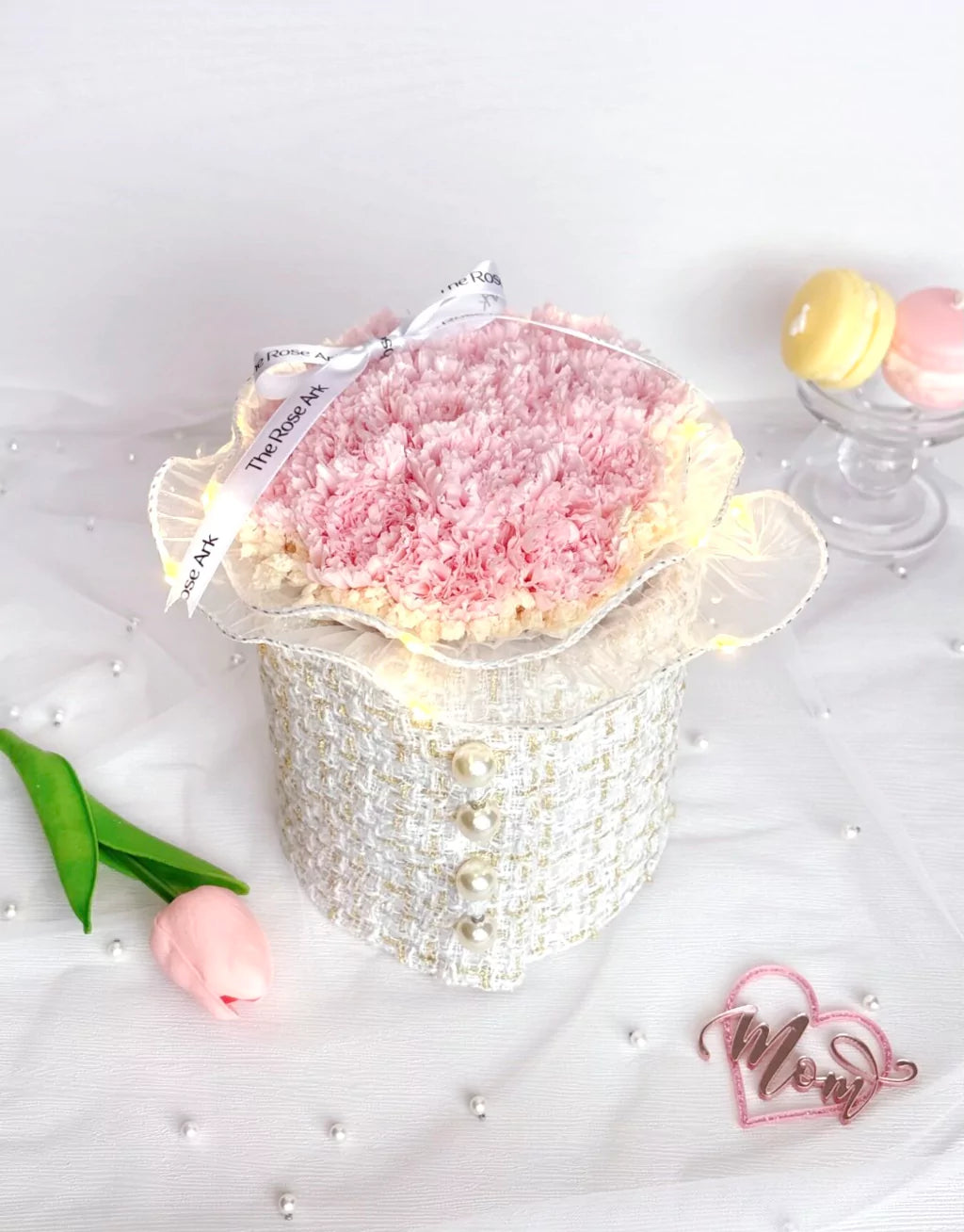Preserved pink carnations in white tweed fabric bloom box