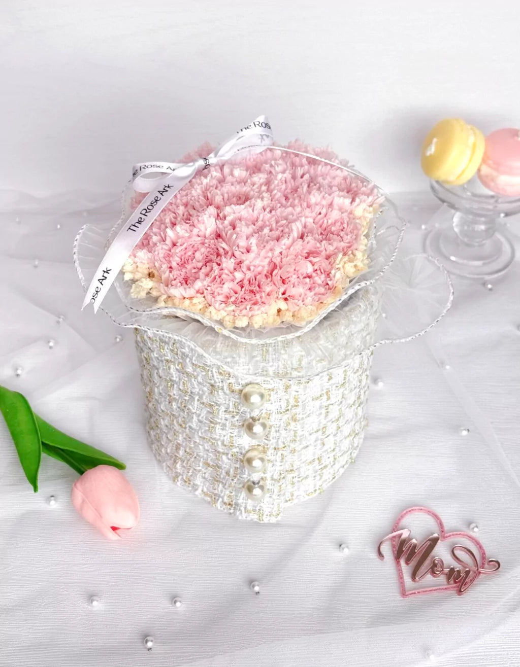 Preserved pink carnations in white tweed fabric bloom box
