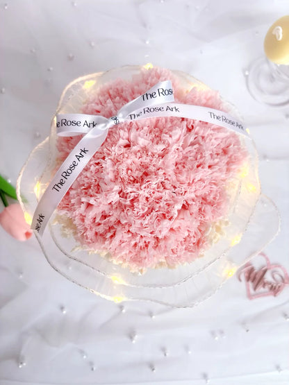 A bloom of preserved pink carnations